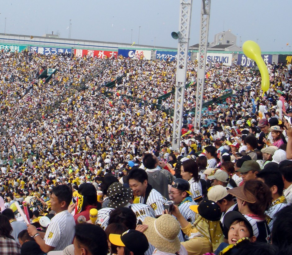 A young boy loses his balloon during a baseball game in Osaka