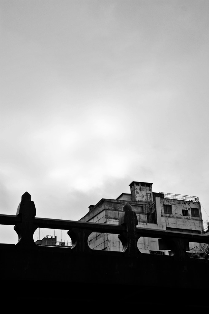 Traditional bridge and an aging building near Dongdaemun, Seoul
