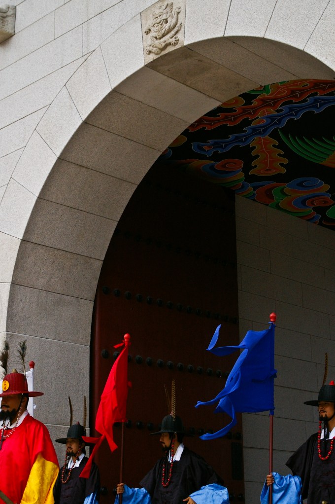 Historical actors parade outside of the Gyeongbokgung Palace