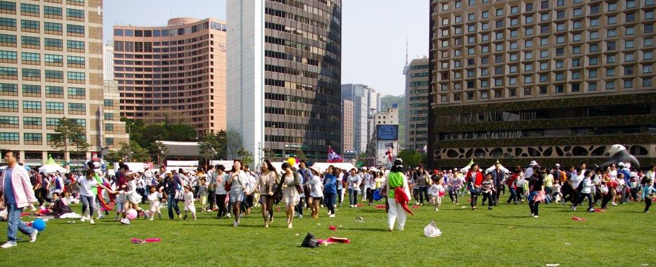 A holiday event has parents and children running around at City Hall in Seoul