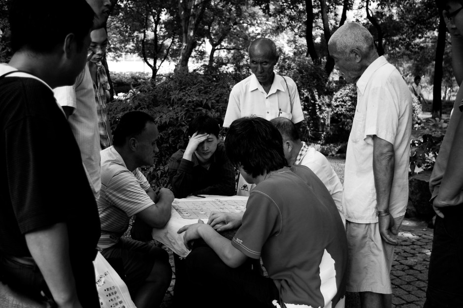 Men play games in Century Park, Shanghai