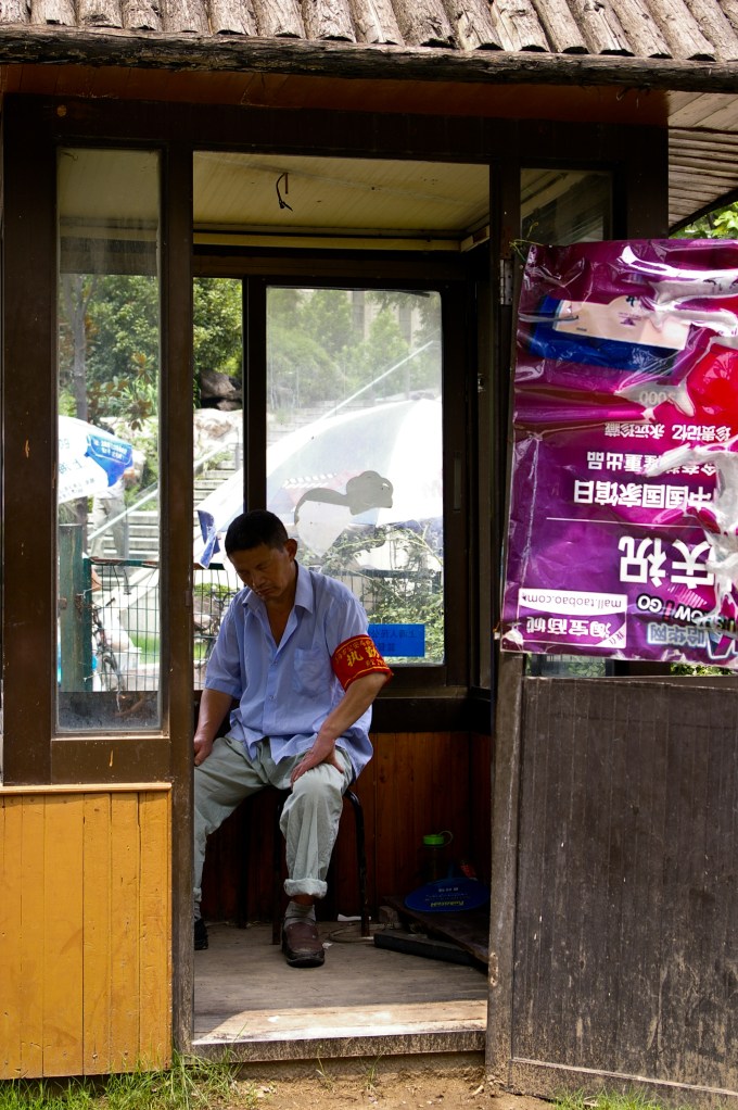 A local security guard naps in the afternoon in Shanghai