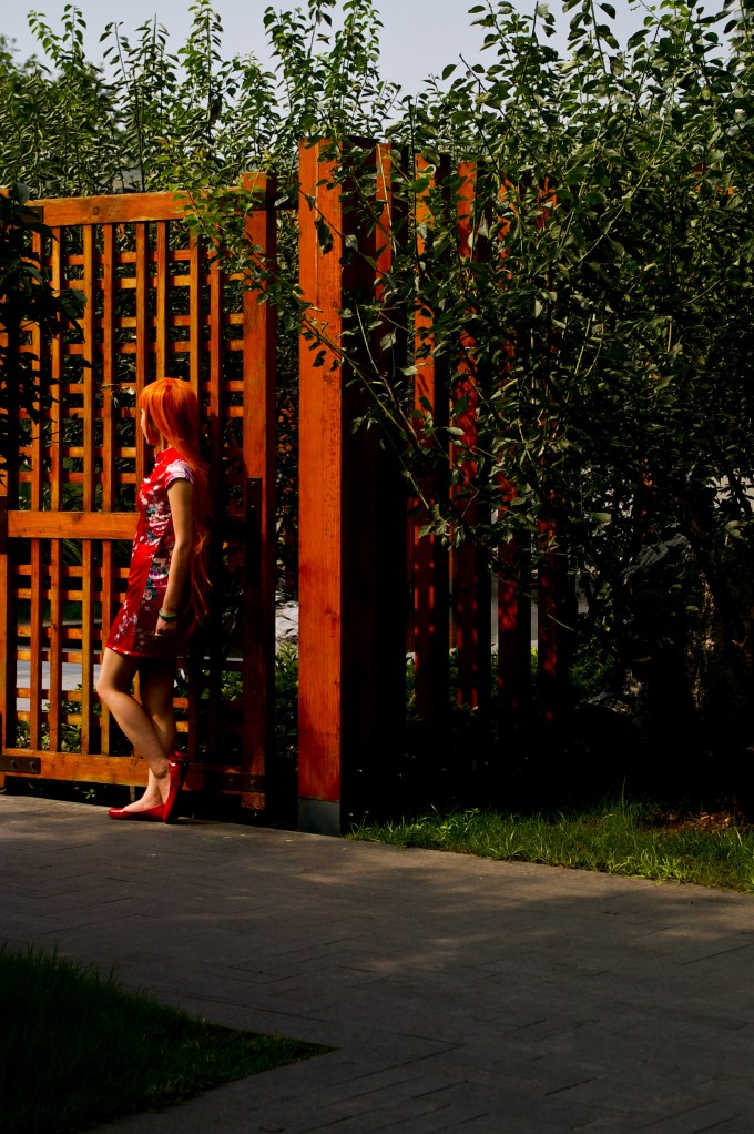 A young woman poses in costume in the Jing'an Sculpture Park