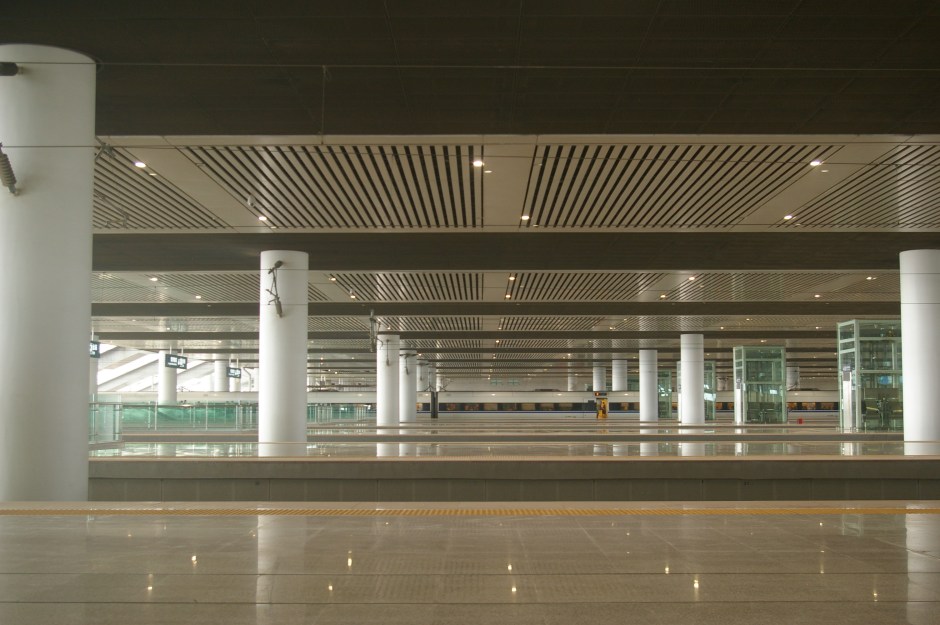 A gleaming, empty high-speed train station in China