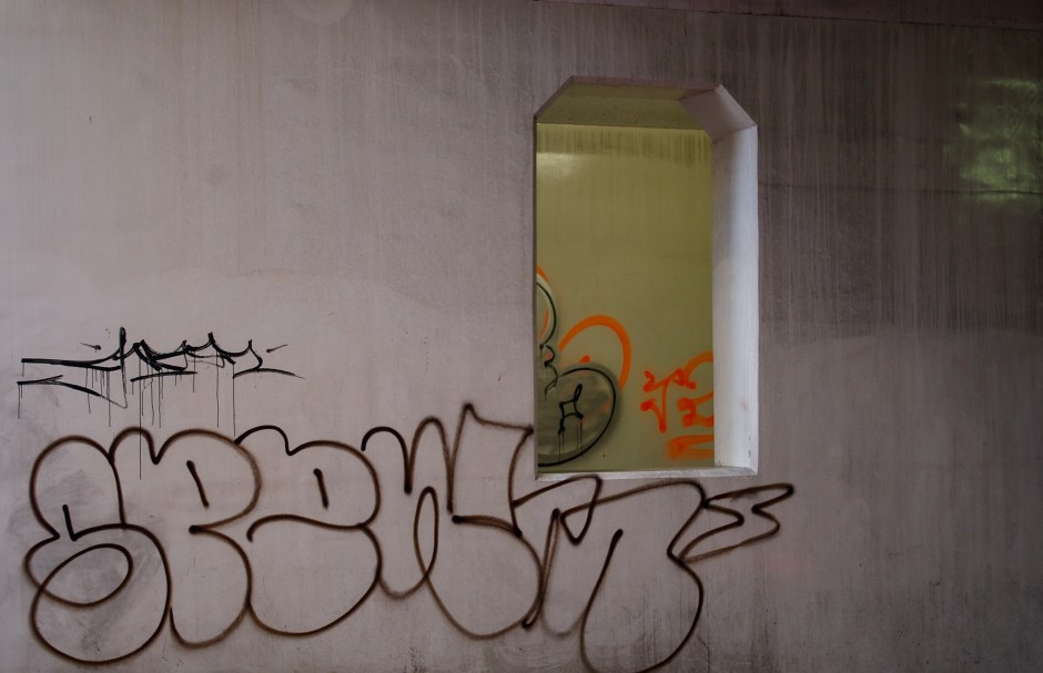 Competing graffiti in a Tokyo underpass.